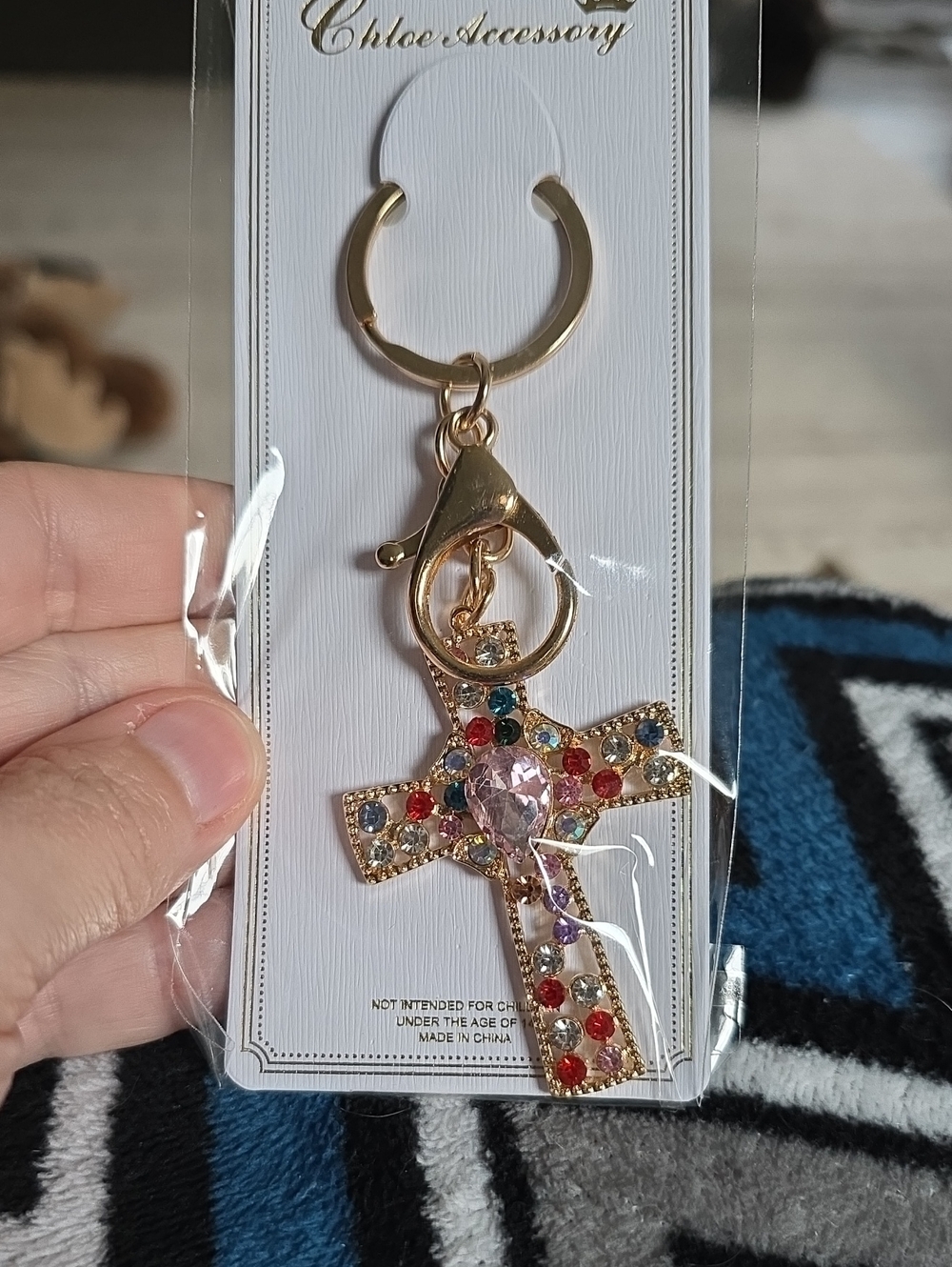 Gold-tone Jeweled Cross Keychain with Pink Center Stone